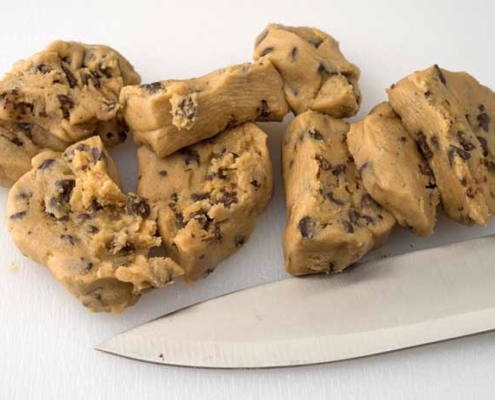 E. coli lawyer -knife rests near cookie dough cut into slices